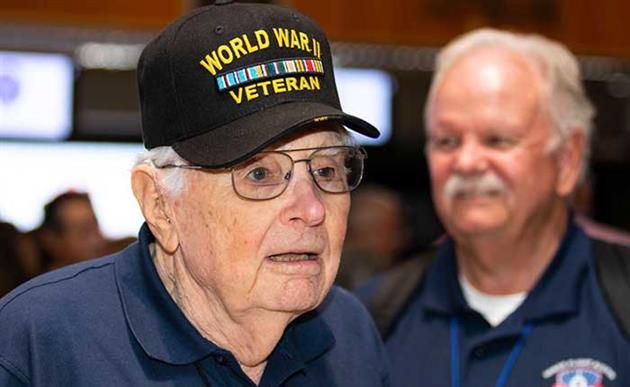 WWII Vet Roy Jacoby and Honor Flight Guardian Jim Hawkins Caliber Sales Manager