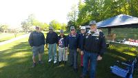 Veterans and Caliber Home Loans employees on lawn at Camp Centurion