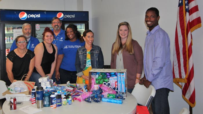 Customer Care collects personal hygiene products for USO center