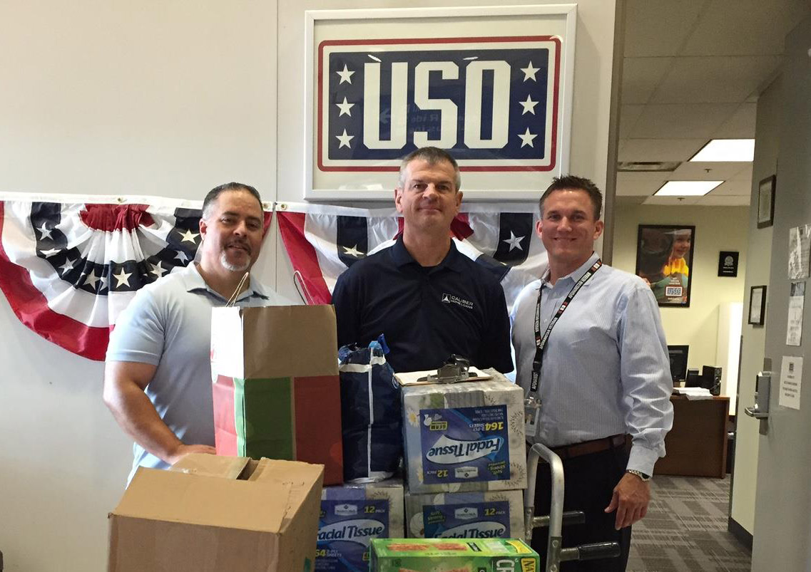 Caliber staff with donations for the 2016 Operation Gratitude Care Package Campaign